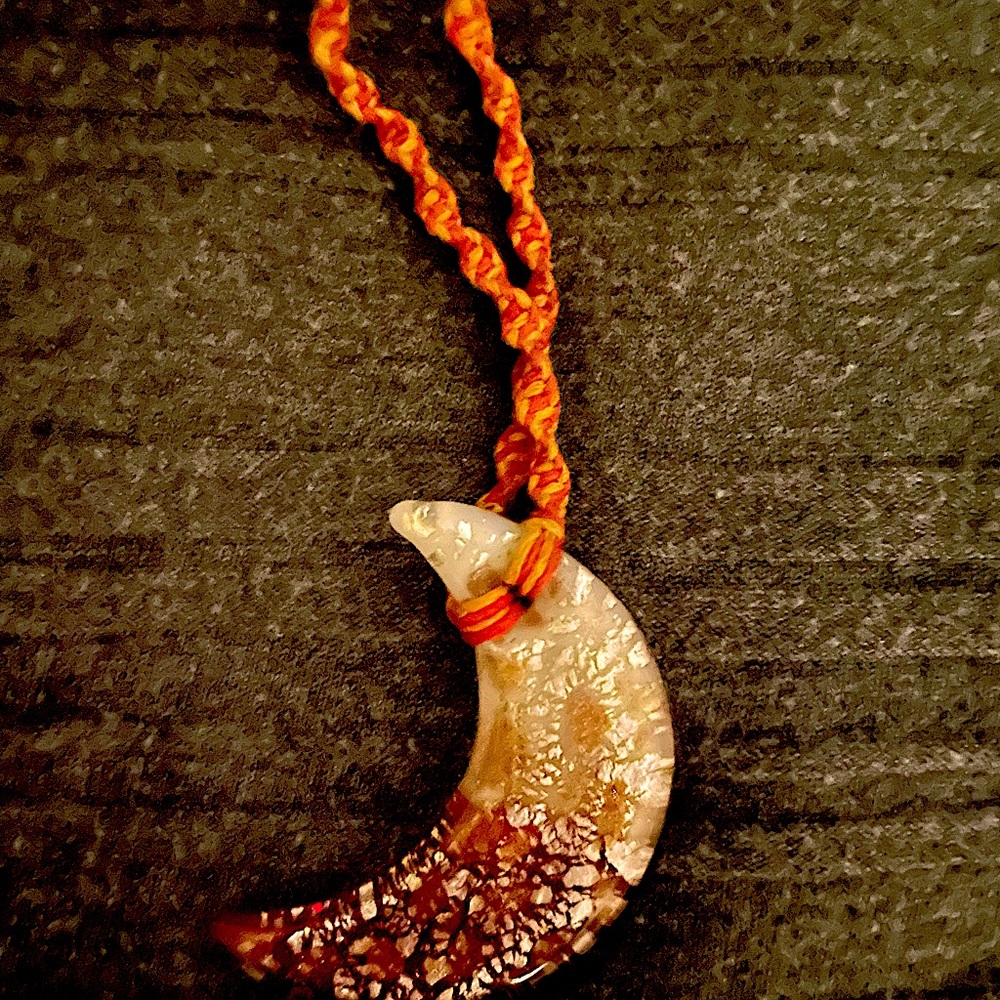 Gold flecked half moon hemp necklace.